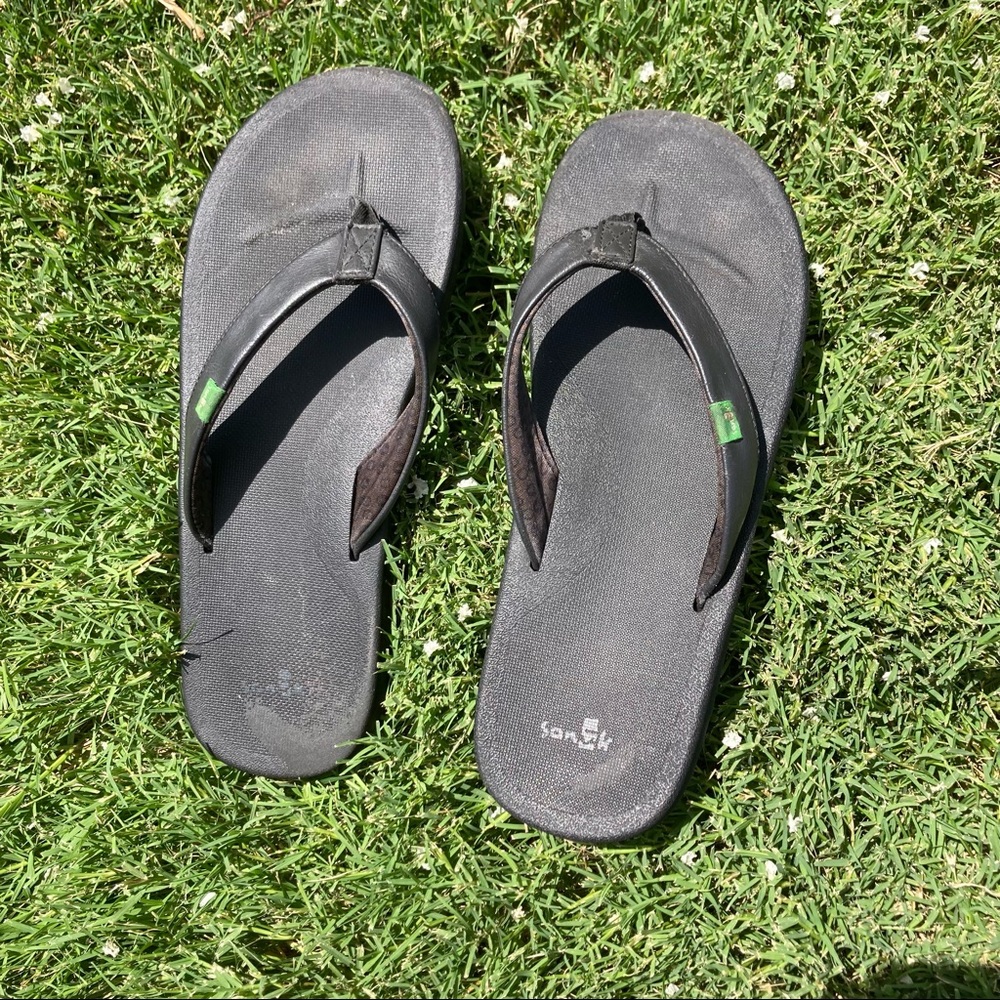 Black Sanuk flip flops